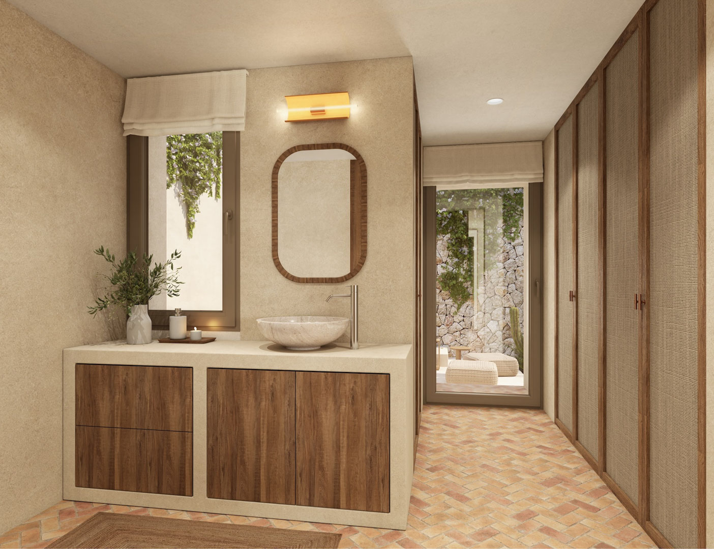 Badkamer met stenen waskom, houten kasten en een terracotta visgraatvloer. Voorzien van inbouwkasten met textielpanelen en directe toegang tot een privépatiotuin.