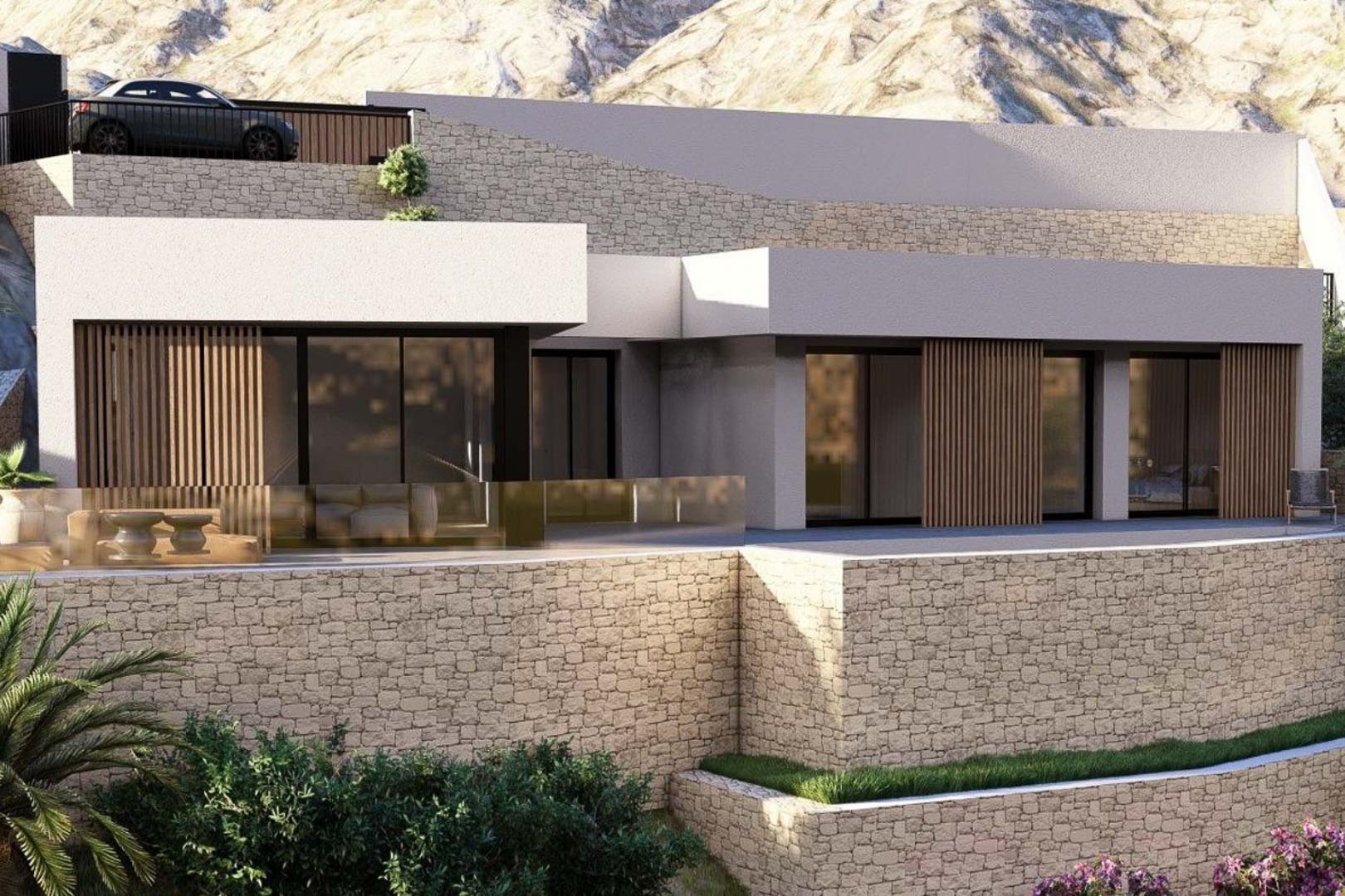 Moderne villa-exterieur met natuurstenen muren, kamerhoge glazen schuifdeuren met houten lamellen en een terras met glazen balustrade tegen een bergachtige achtergrond.