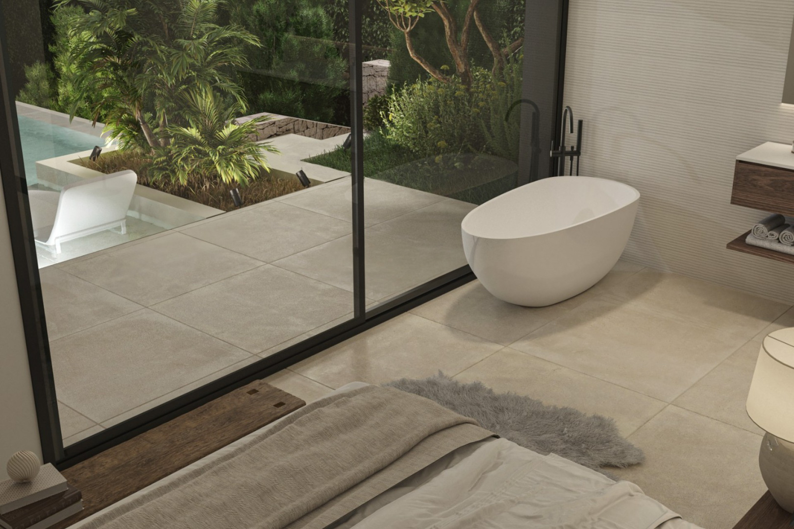 Master suite met vrijstaand designbad en kamerhoge glazen schuifdeuren die toegang bieden tot het privéterras en de mediterrane tuin.