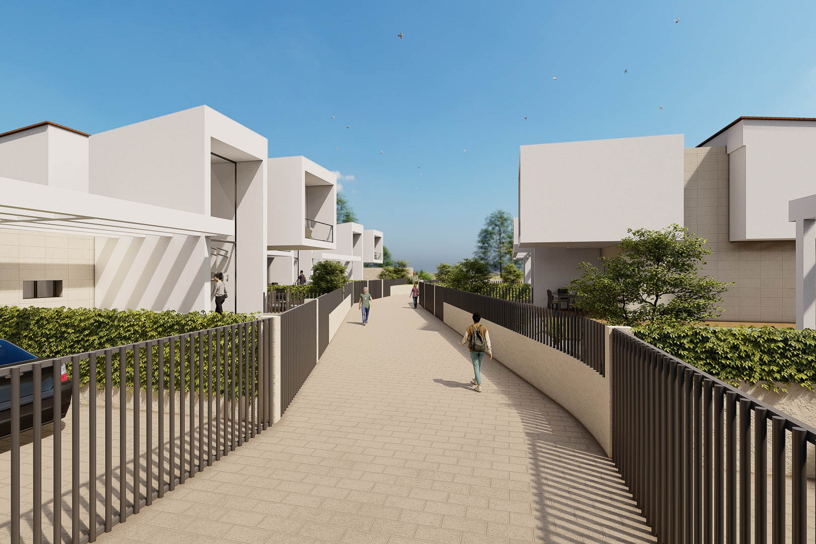 Exterieur van het complex met minimalistische witte villa's, donkere metalen hekwerken en een geplaveid pad omgeven door groen.