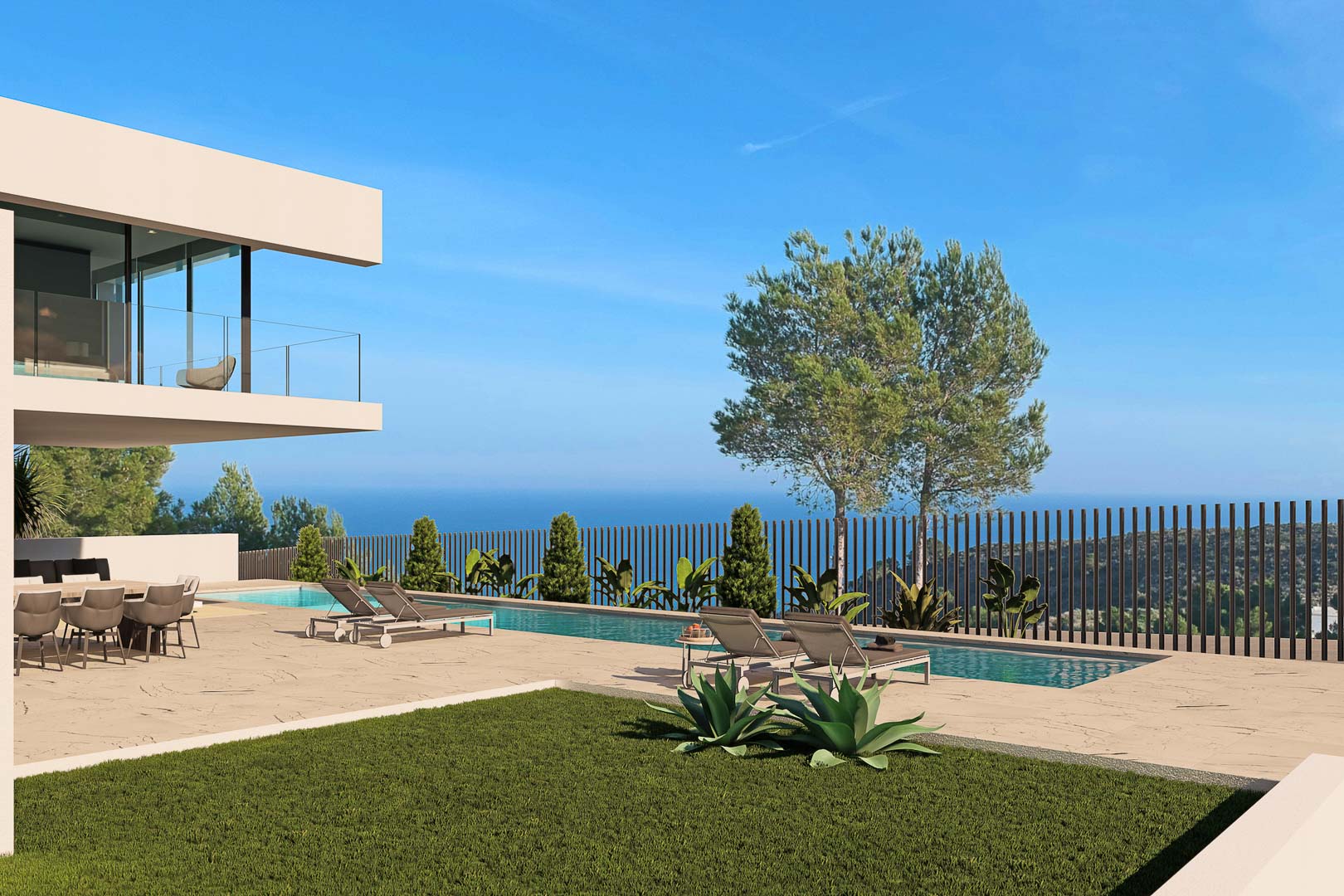 Uitzicht op het zwembad met ligstoelen, tuin en uitzicht op zee vanuit de villa in Moraira.
