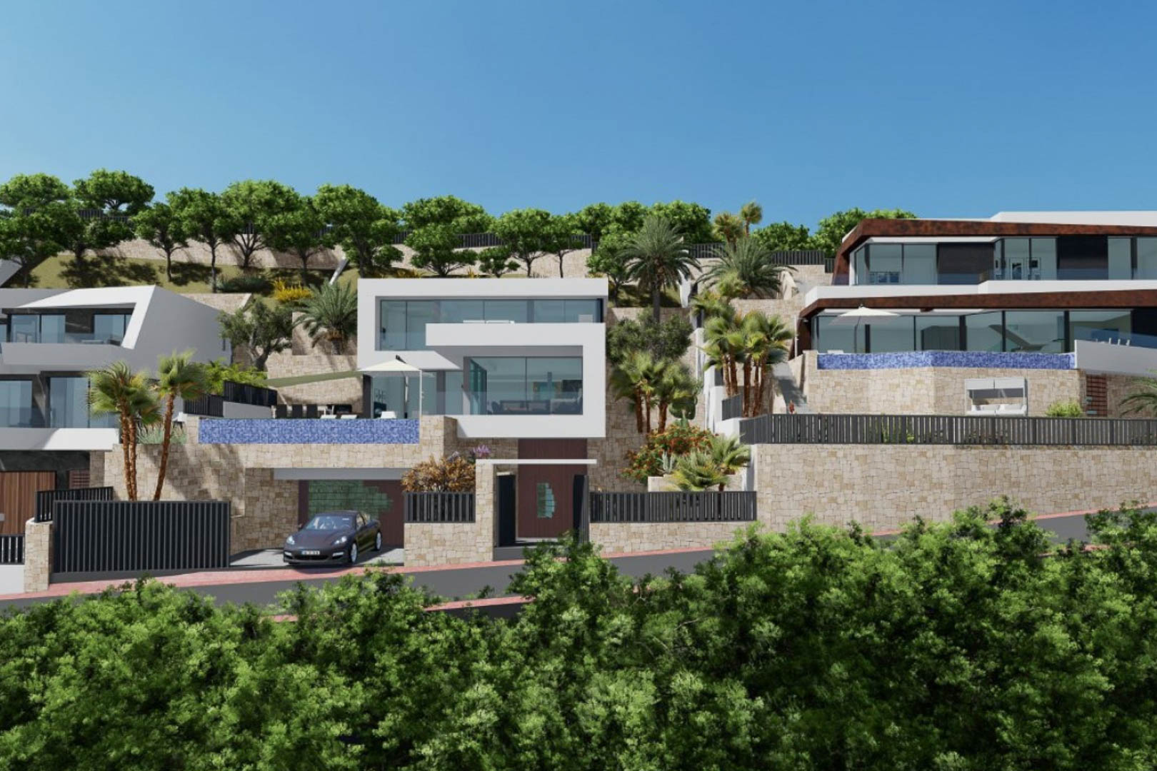 Buitenaanzicht van de moderne villa met kubistische architectuur, natuurstenen muren, infinity pools met blauw mozaïek en aangelegde tuinen op de helling.
