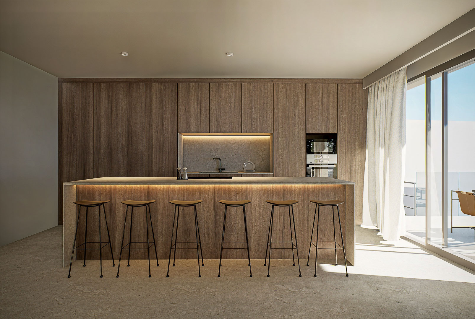 Designkeuken met een stenen kookeiland, minimalistische barkrukken en kamerhoge houten kastenwanden voorzien van geïntegreerde ledverlichting en terrasdeur.