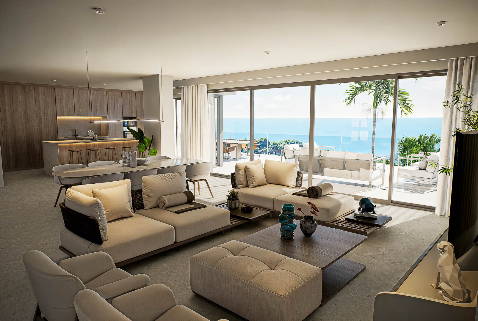 Open woonruimte met modulaire banken, houten designkeuken en grote glazen schuifdeuren die uitkijken op het terras en de Middellandse Zee.