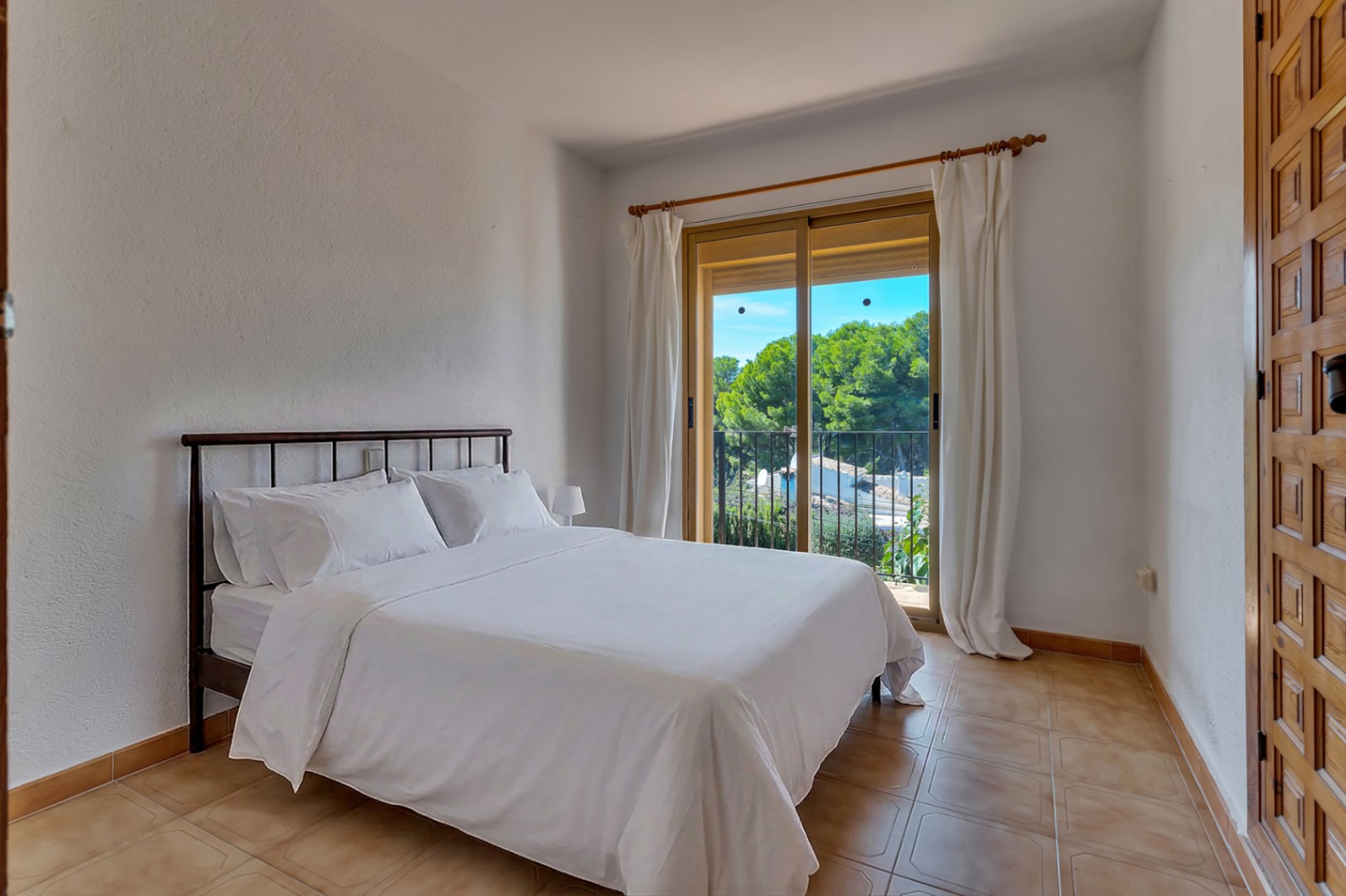 Slaapkamer met balkon