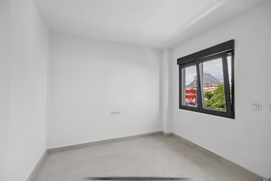 Slaapkamer met bergzicht
