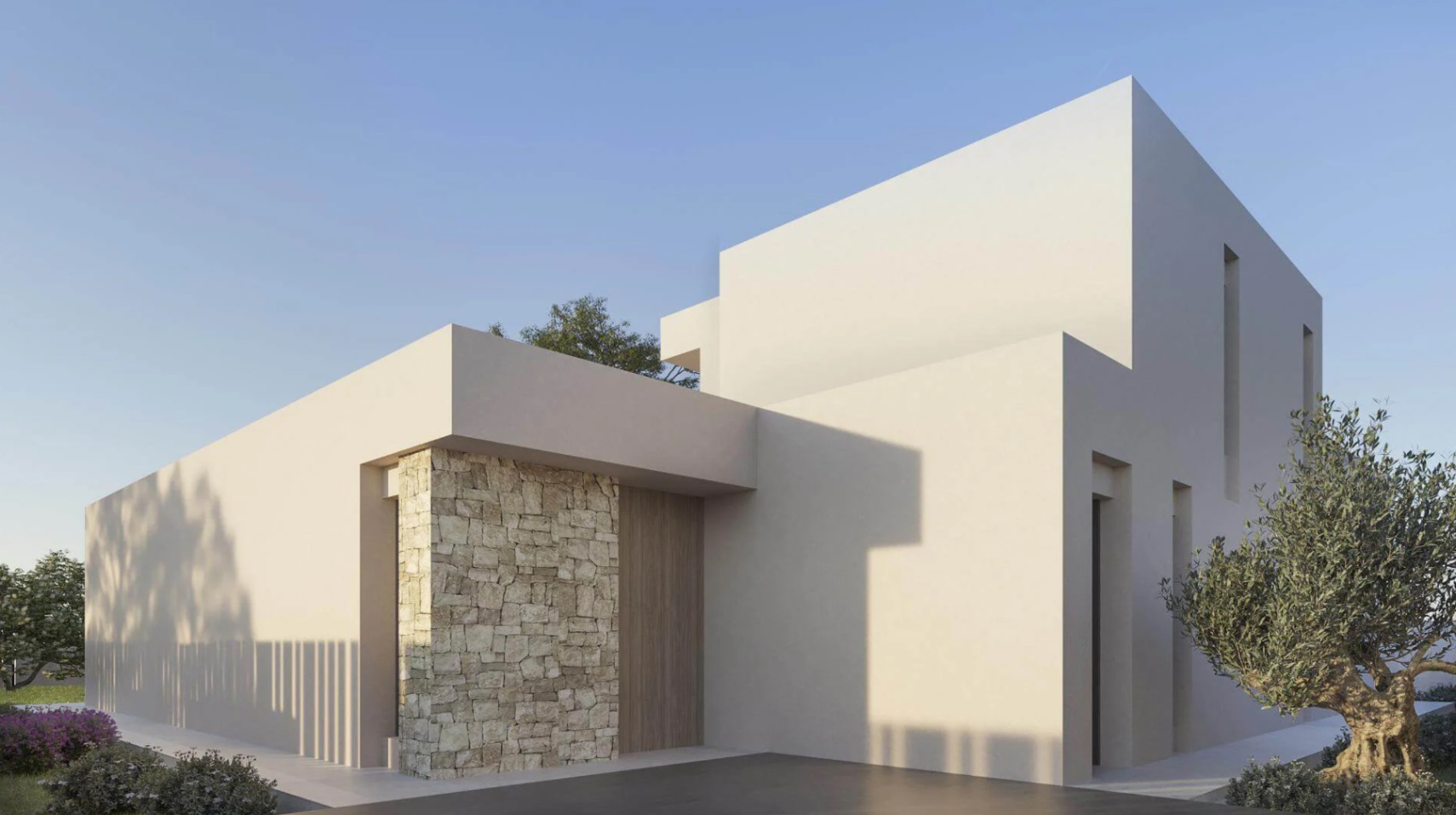 Exterieur van een eigentijdse villa met minimalistische witte volumes, een natuurstenen accentmuur en een houten voordeur.