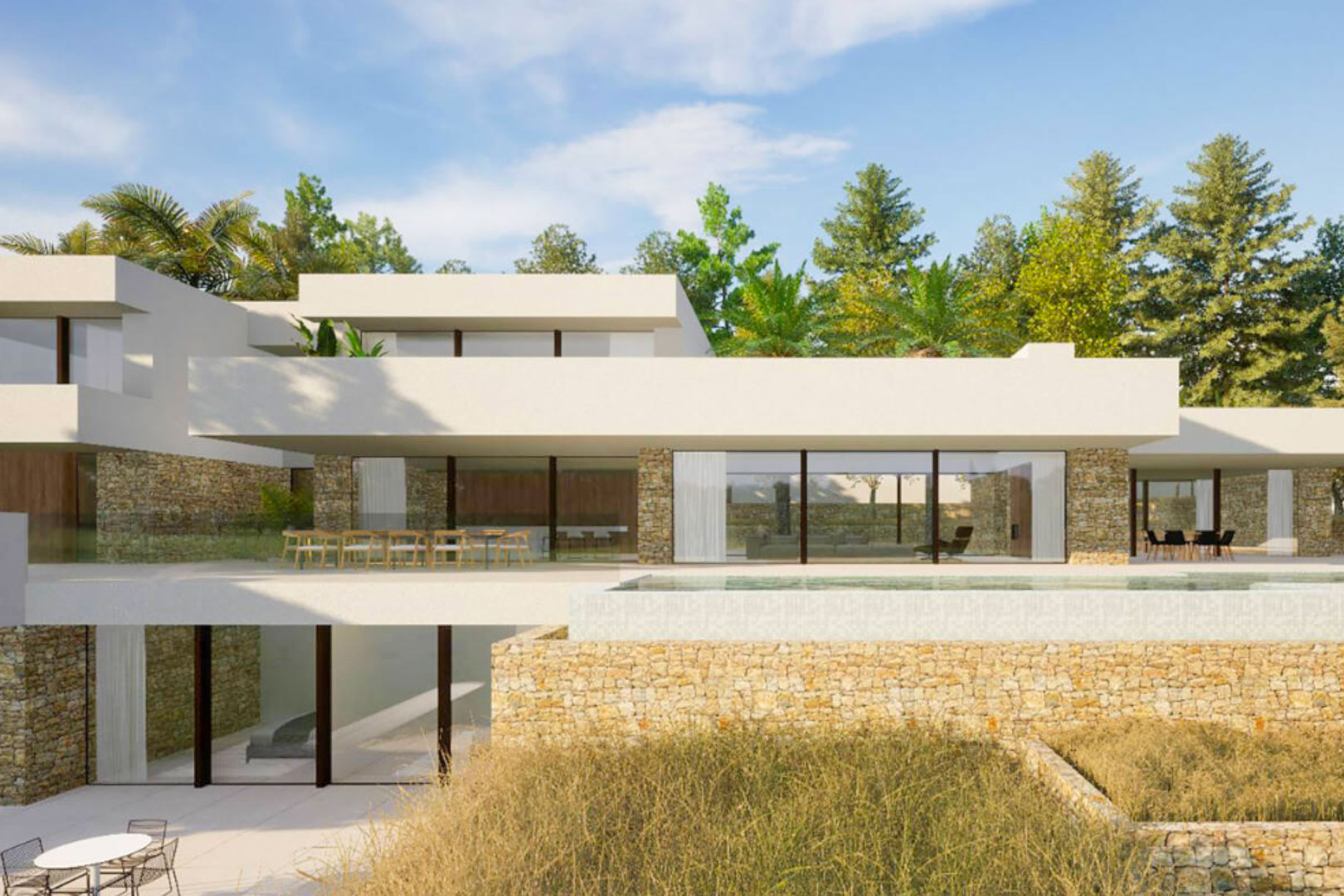 Moderne villa met drie verdiepingen, natuurstenen muren, kamerhoge glaspartijen en een overloopzwembad geïntegreerd in het hoofdterras.