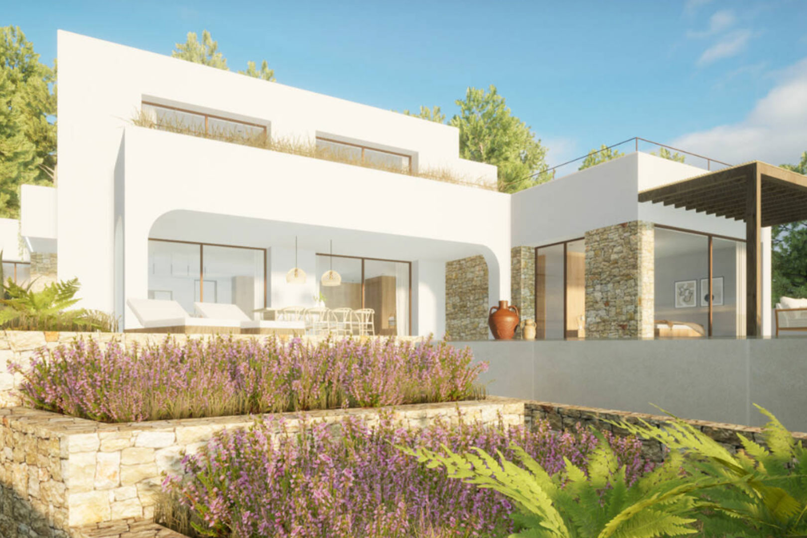 Exterieur van de villa met een terrasvormige tuin en natuurstenen gevel.
