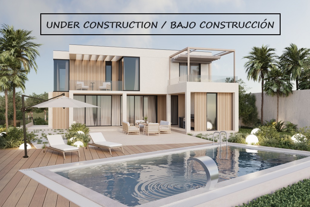 Uitzicht op de villa in Calpe met zwembad, ligstoelen en een eethoek buiten. Modern design en weelderige tuinen.