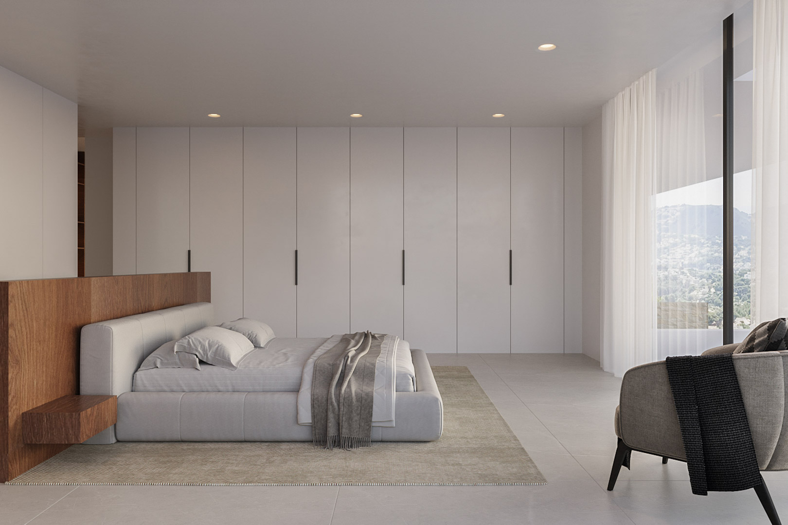 Moderne slaapkamer met minimalistische inbouwkasten, houten hoofdbord en grote raampartijen die een weids uitzicht bieden over de bergen.