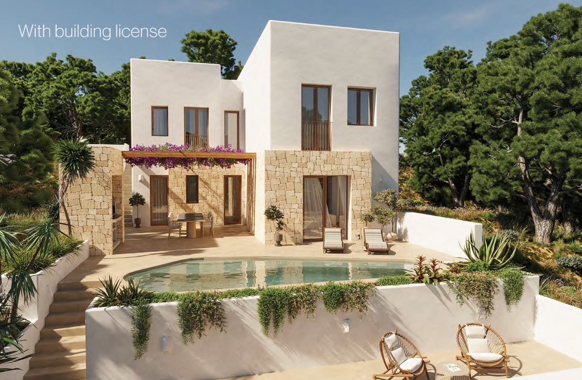 Buitenaanzicht van de villa met zwembad, terras met ligstoelen en zithoek met rotan stoelen.
