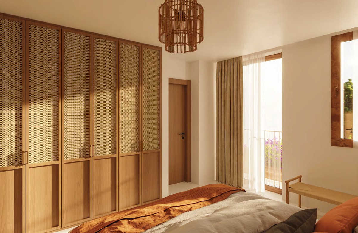 Slaapkamer met houten kledingkast en hanglamp van wicker.