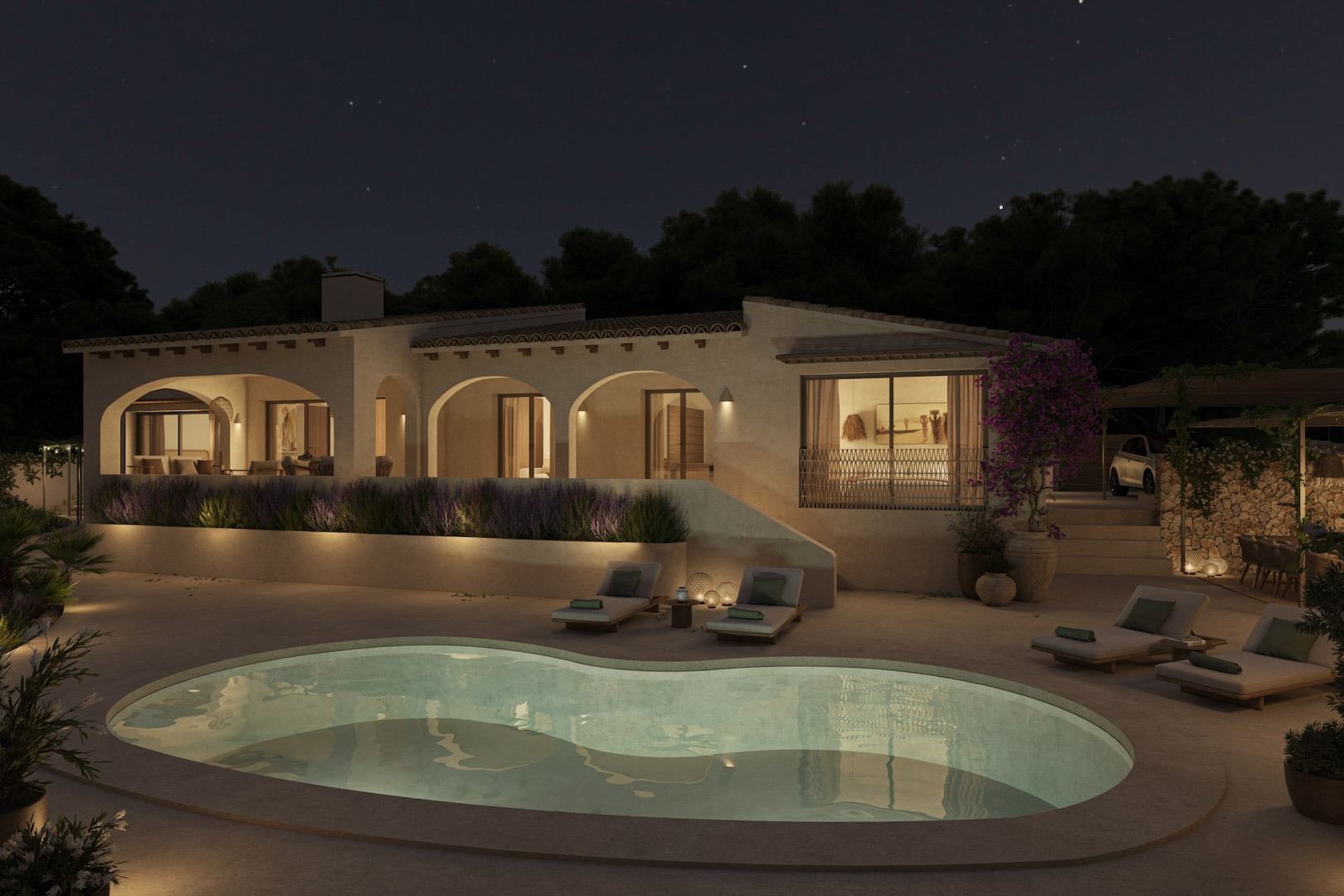 Nachtzicht op de villa met verlichte bogen, een niervormig zwembad en een ruim terras met ligbedden, omgeven door mediterrane tuinen en lavendel.