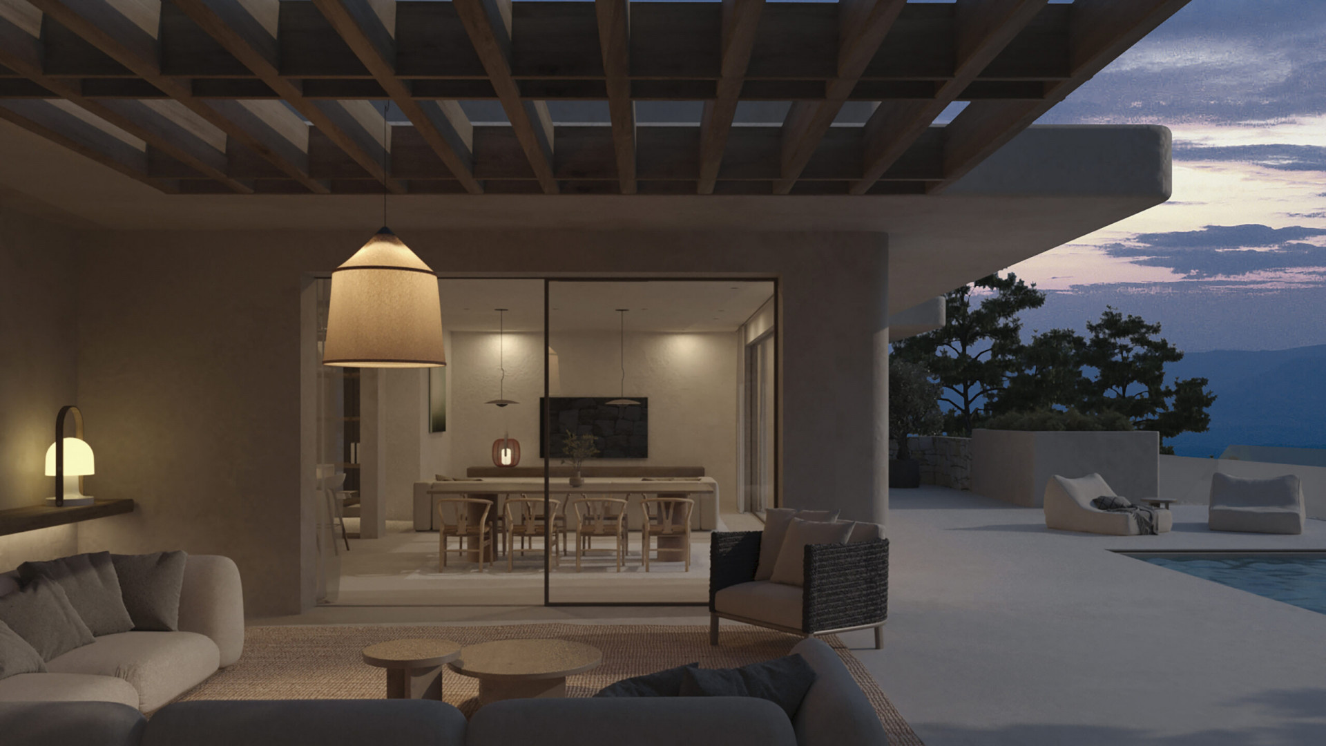 Sfeervolle buitenwoonkamer onder houten pergola met moderne banken en hanglamp, grenzend aan een elegante eetruimte met berguitzicht bij zonsondergang.