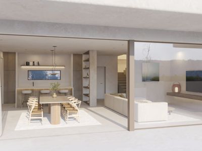 Ruime open woon- en eetkamer met houten tafel en ontbijtbar, naadloos verbonden met het terras via grote glazen schuifdeuren.
