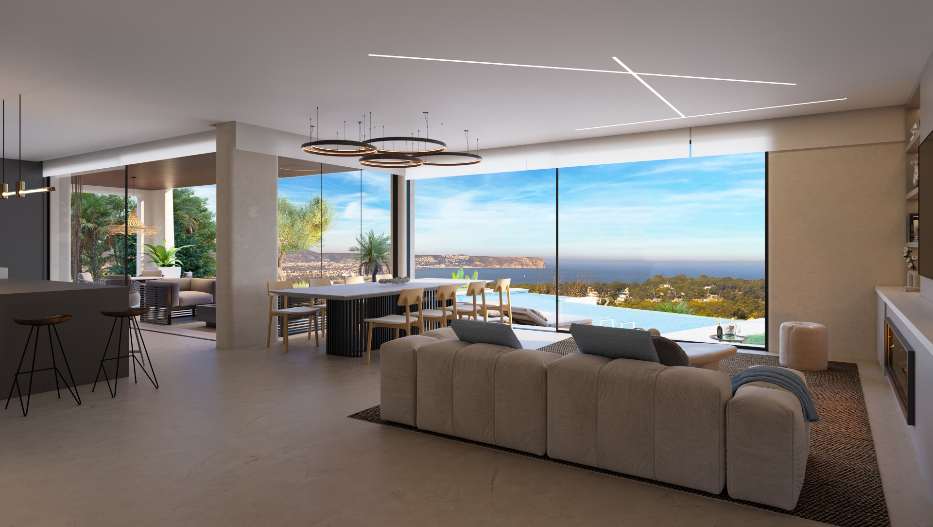 Ruime woonkamer met panoramisch uitzicht op zee, open keuken en moderne meubels in Jávea.