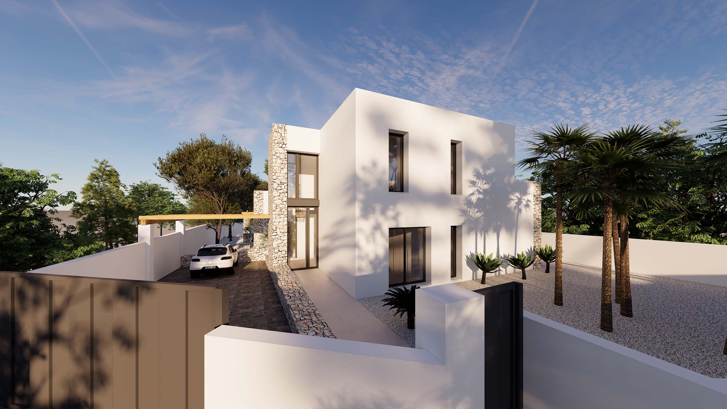 Exterieur in Ibiza-stijl met natuurstenen muren, witte architectuur en een grindtuin met palmbomen. De oprit biedt toegang tot een parkeerplaats met pergola.