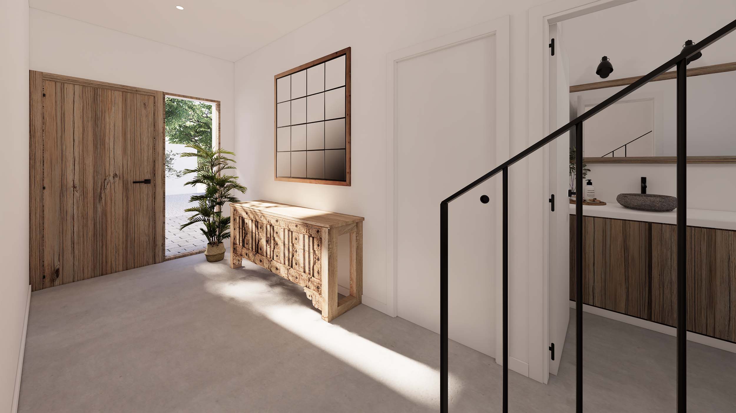 Entreehal met natuurhouten deur, bewerkte console en microcementvloer. De ruimte biedt toegang tot een badkamer met een stenen waskom en zwarte accenten.