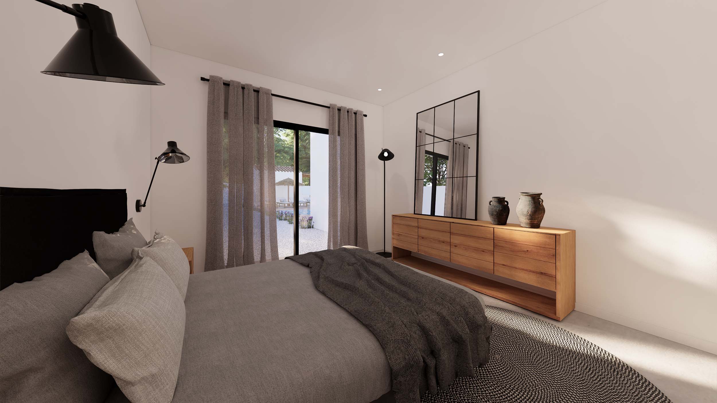 Slaapkamer met een dressoir van natuurlijk hout, industriële spiegel en directe toegang tot de tuin via grote glazen schuifdeuren.