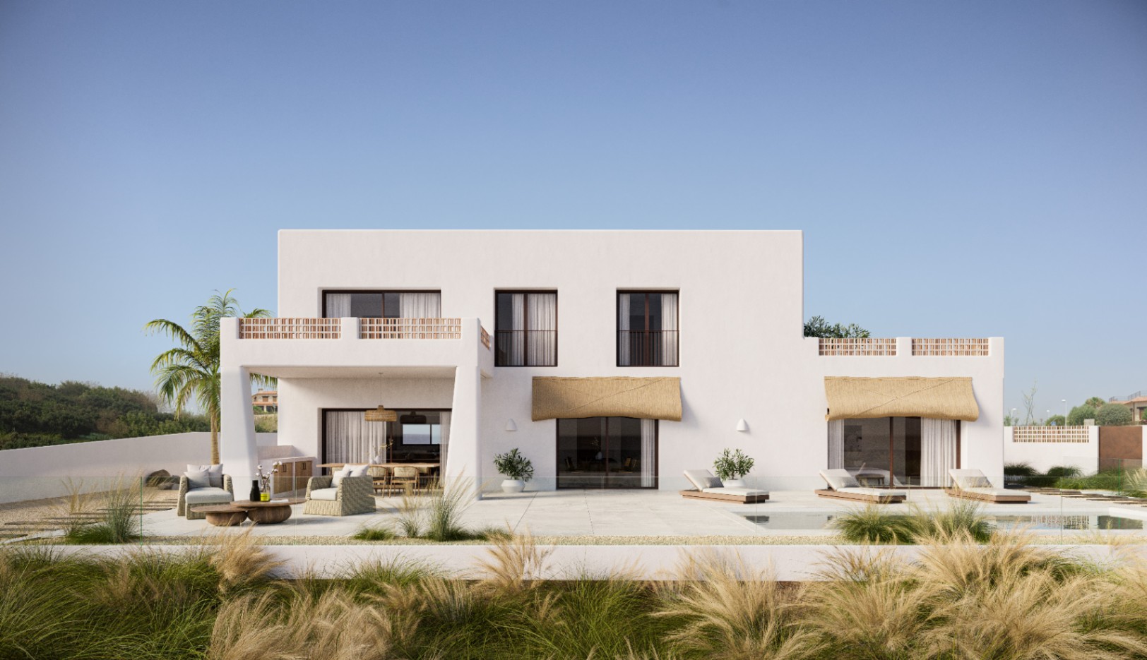 Buitengevel van de witte minimalistische villa met een groot stenen terras, buitenlounge, zwembad en balkons met decoratieve terracotta balustrades.
