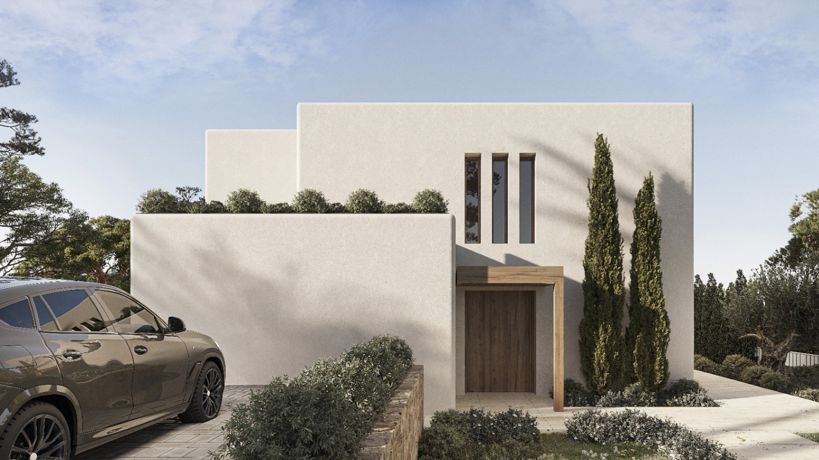 Moderne villa-gevel in Benissa met houten deur en verzorgd groen.