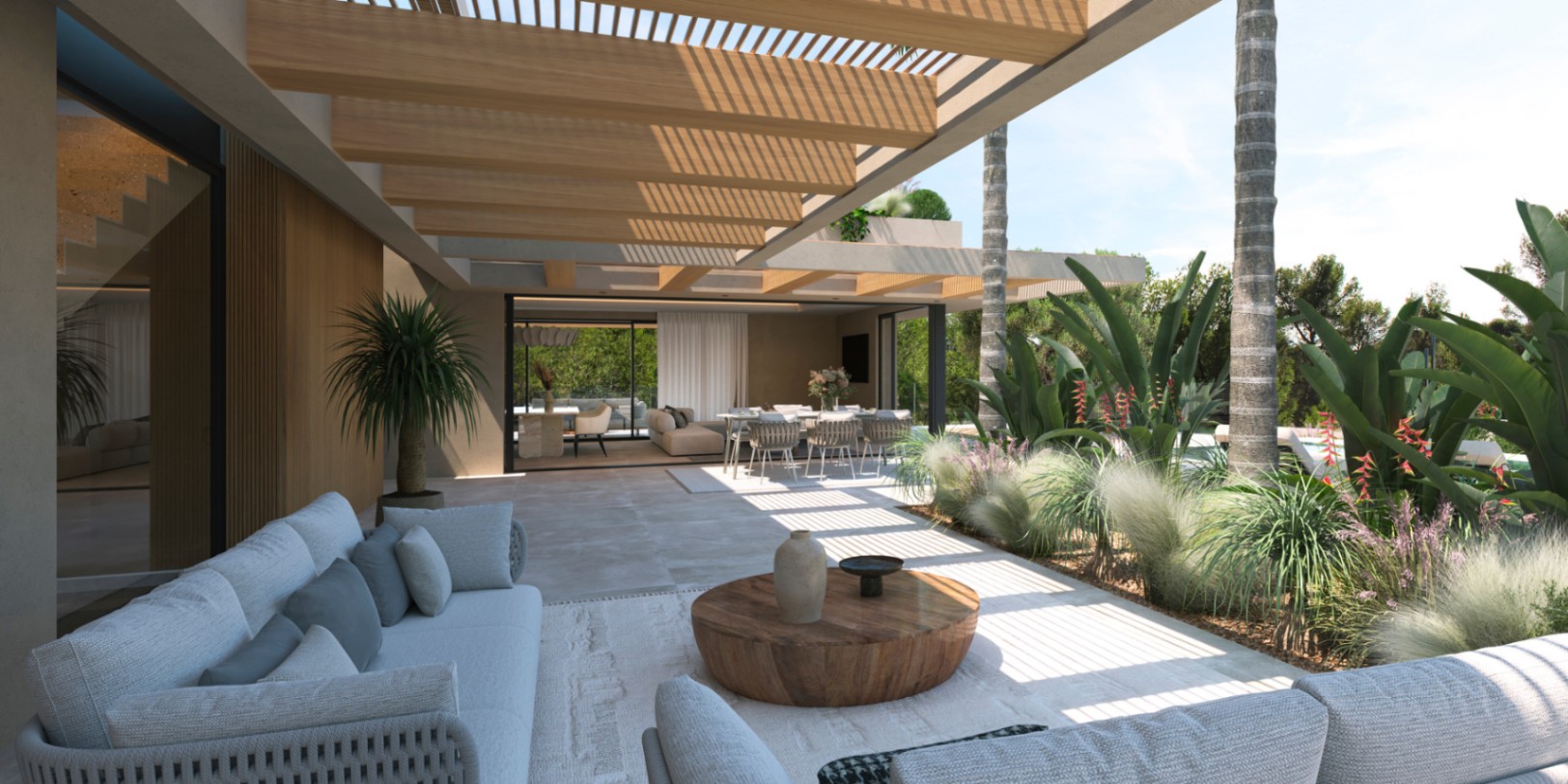 Overdekt terras met houten pergola en stenen vloer, die de buitenlounge naadloos verbindt met het interieur via grote glazen schuifdeuren.