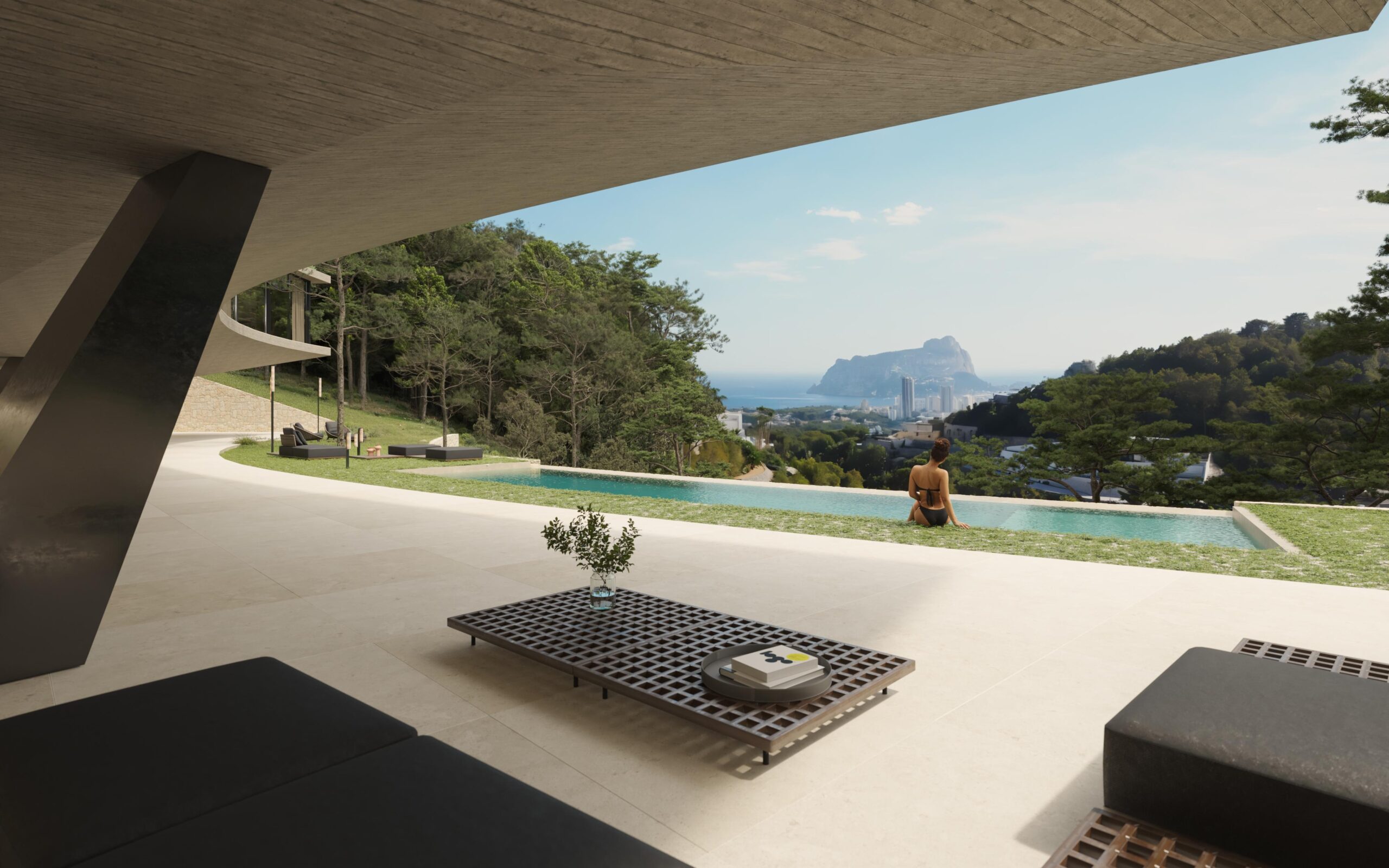 Modern terras met een plafond van zichtbeton, een overloopzwembad en panoramisch uitzicht op de Peñón de Ifach en de Middellandse Zee.