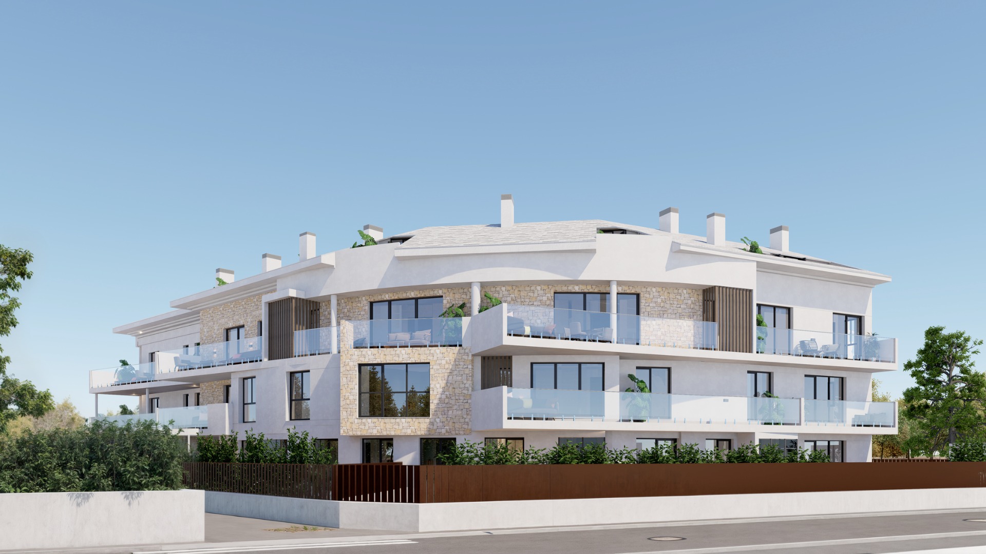 Buitenaanzicht van het gebouw met drie verdiepingen, witte gevel met natuurstenen details, gebogen glazen terrassen en donkere kozijnen.