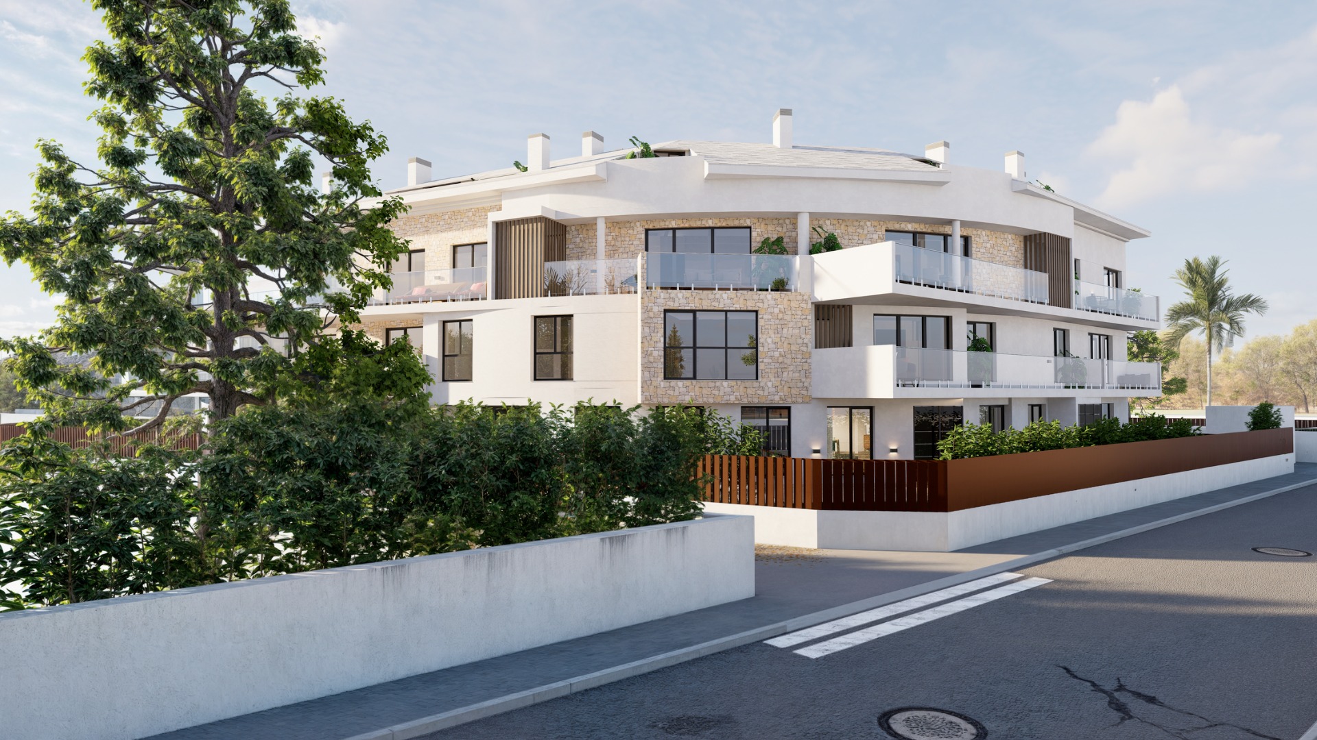 Modern woongebouw van drie verdiepingen met gebogen gevel, natuurstenen details, terrassen met glazen balustrades en een aangelegde groenstrook.
