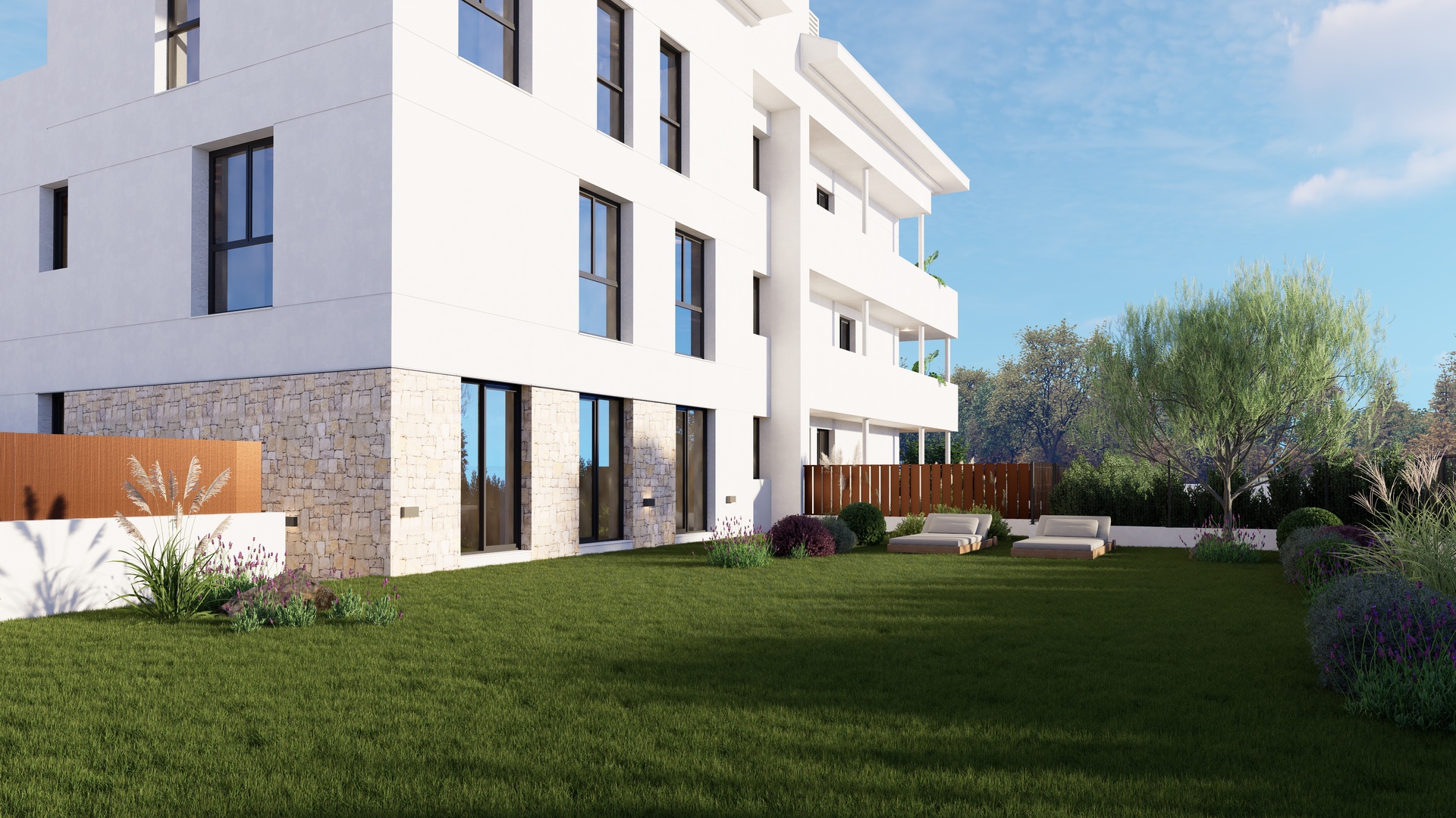 Moderne witte gevel met natuurstenen plint, voorzien van een eigen verzorgd gazon en aangelegde tuin met comfortabele ligbedden.